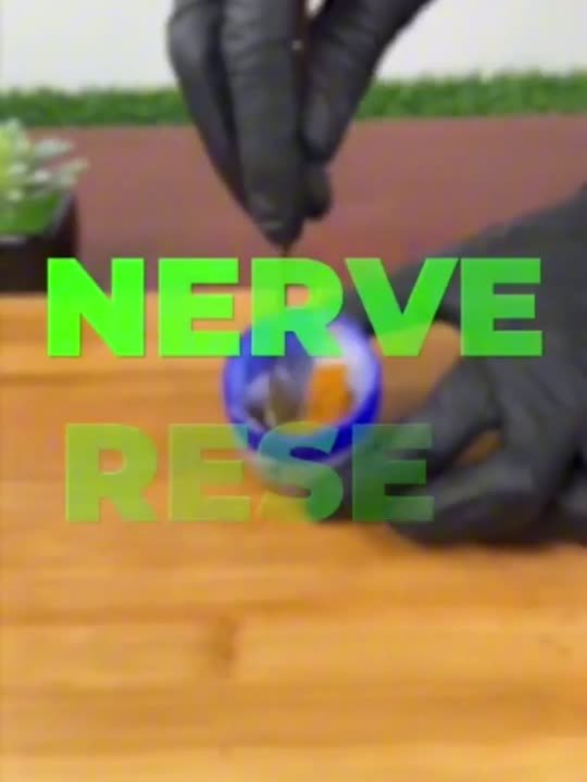 Gloved hands during the nerve reset scene from the video
